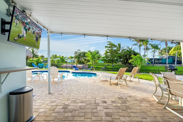 view of pool with a patio area, a fenced backyard, and a fenced in pool