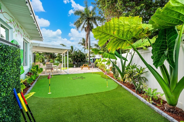 view of yard featuring a patio area and a fenced backyard