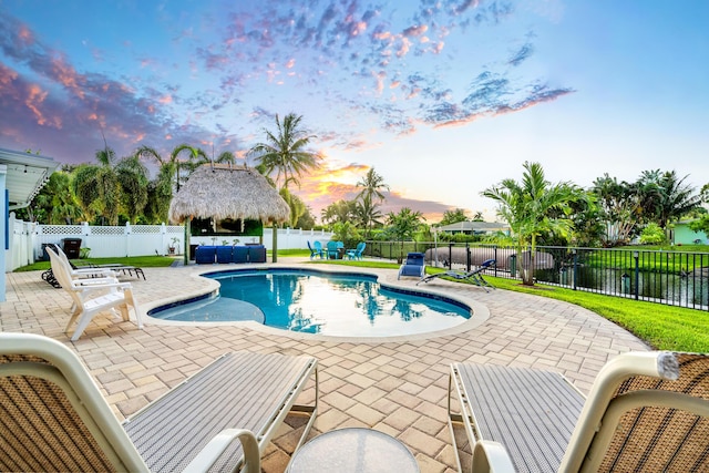 view of swimming pool with a gazebo, a patio area, a fenced backyard, and a fenced in pool