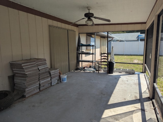 exterior space with ceiling fan