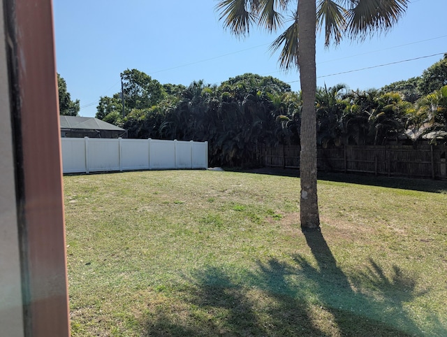 view of yard with a fenced backyard