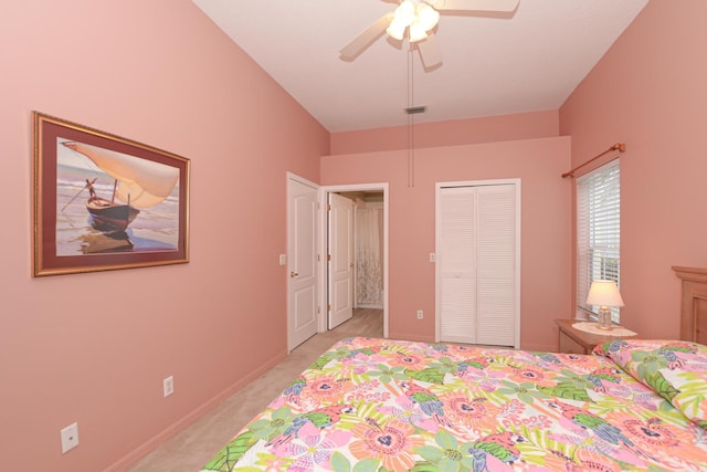 bedroom with visible vents, baseboards, light colored carpet, a closet, and a ceiling fan