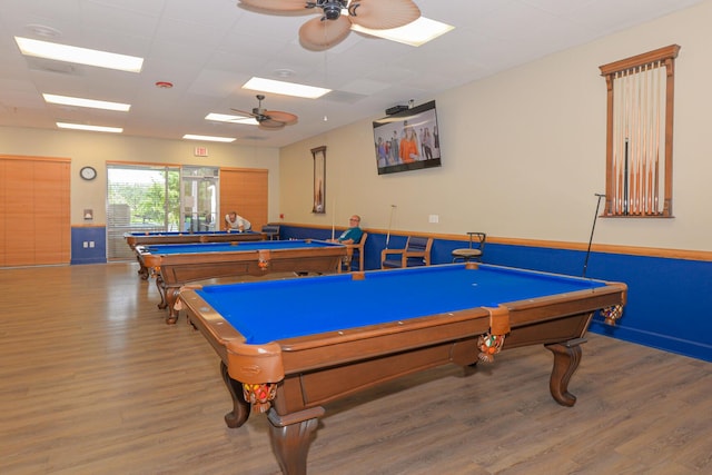 game room with a drop ceiling, billiards, ceiling fan, and wood finished floors