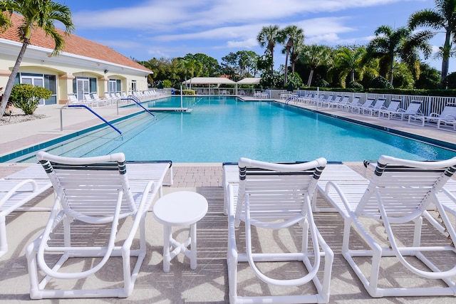 pool featuring a patio and fence