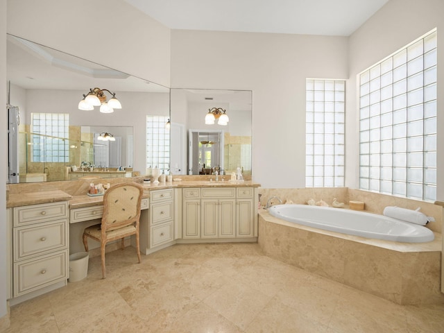 full bathroom featuring a bath, a healthy amount of sunlight, a walk in shower, and vanity