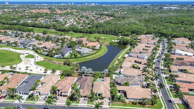 birds eye view of property featuring a residential view, a water view, and view of golf course