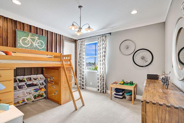 carpeted bedroom featuring recessed lighting, a notable chandelier, baseboards, and a textured ceiling