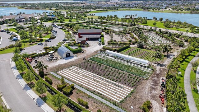 drone / aerial view featuring a rural view and a water view