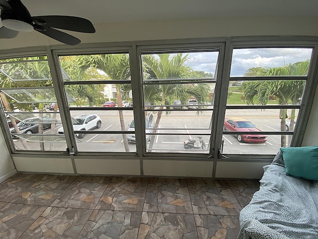 sunroom / solarium with ceiling fan