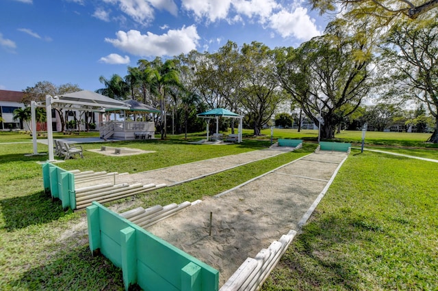 view of community featuring a lawn