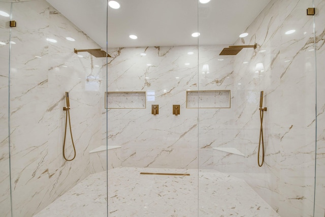 bathroom with a marble finish shower and recessed lighting