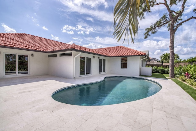 view of pool featuring fence, a fenced in pool, and a patio