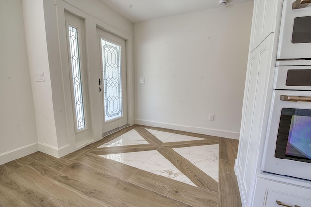 entrance foyer with baseboards