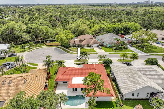 aerial view with a residential view and a view of trees