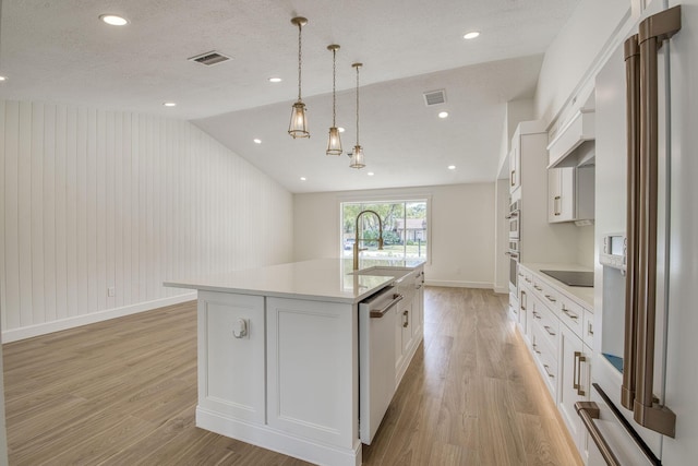 kitchen with lofted ceiling, white appliances, light wood-style flooring, and visible vents