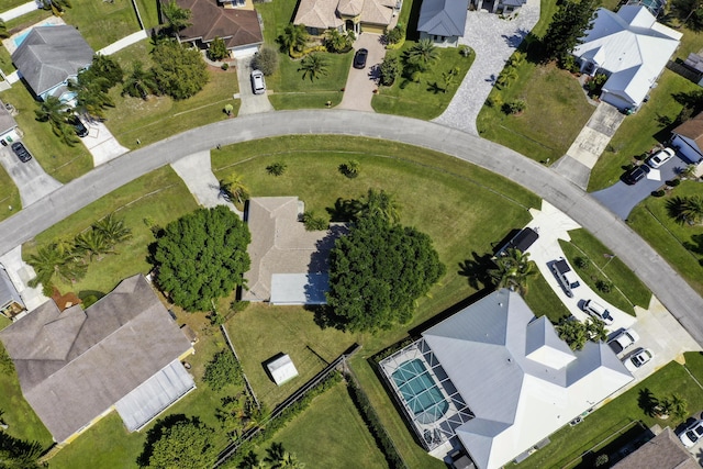 birds eye view of property with a residential view