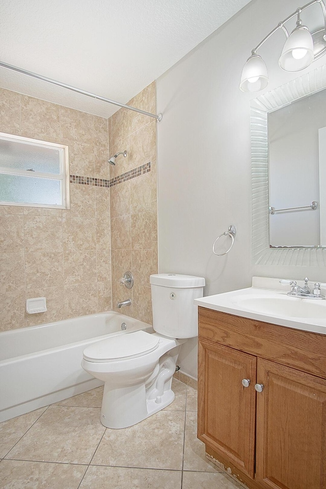 bathroom featuring toilet, tile patterned flooring,  shower combination, and vanity