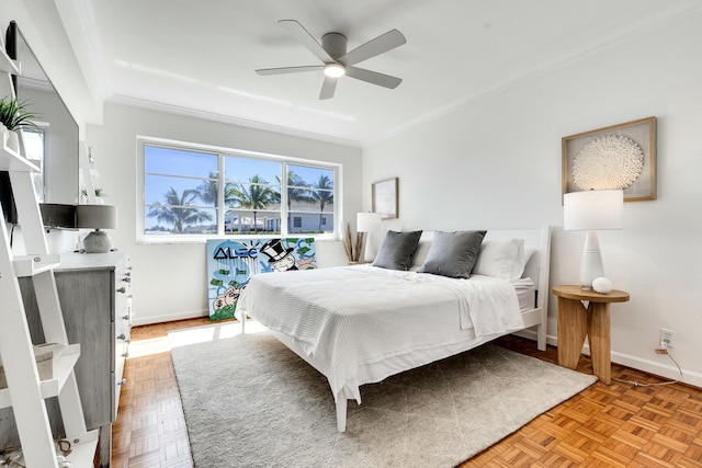 bedroom with ceiling fan, baseboards, and ornamental molding