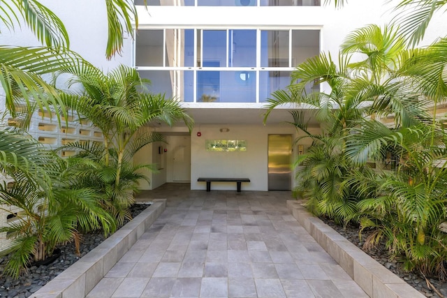 property entrance featuring stucco siding