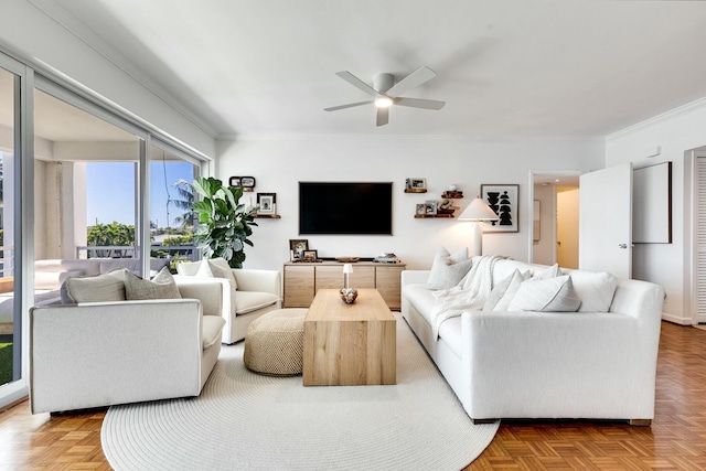 living room featuring ceiling fan and ornamental molding