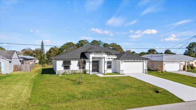 view of front of house featuring driveway, a garage, fence, a front yard, and stucco siding