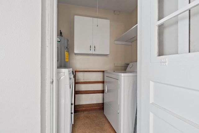 clothes washing area featuring water heater and laundry area