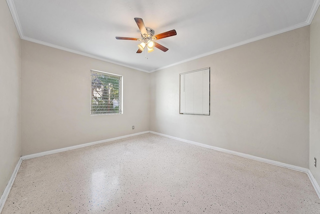 empty room with baseboards, ornamental molding, and a ceiling fan