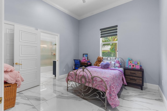 bedroom featuring ensuite bath, crown molding, baseboards, and marble finish floor