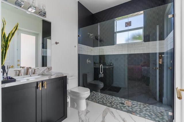 bathroom with marble finish floor, a stall shower, toilet, and vanity