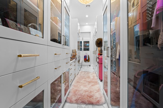 spacious closet featuring visible vents