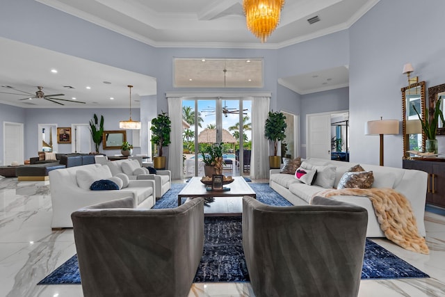 living room with visible vents, ceiling fan with notable chandelier, a towering ceiling, and ornamental molding