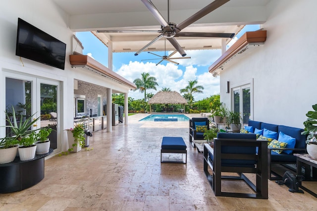 view of patio / terrace with a gazebo, french doors, an outdoor hangout area, an outdoor pool, and a ceiling fan