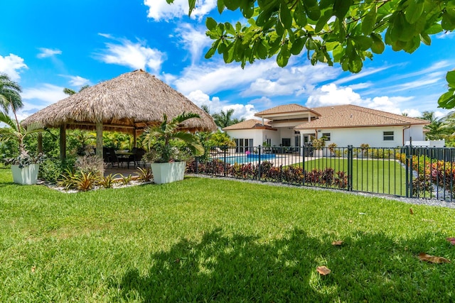 view of yard featuring a patio area, a gazebo, and fence