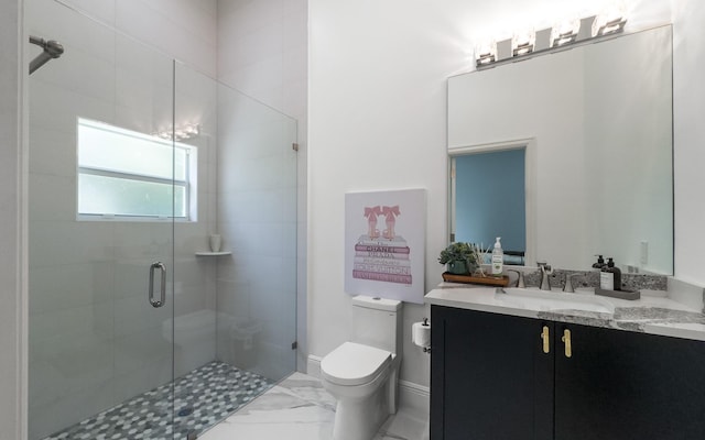 full bath featuring toilet, marble finish floor, a stall shower, baseboards, and vanity