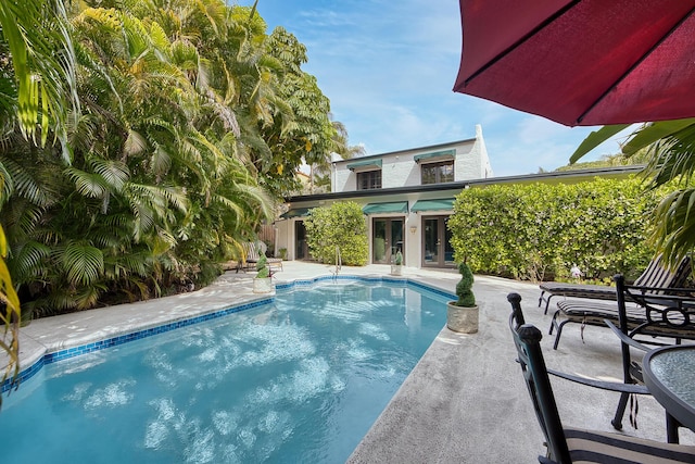 270 Cordova Rd, West Palm Beach, FL 33401 - pool with french doors and a patio area