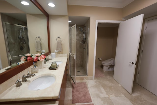 full bathroom with vanity, a shower stall, and toilet