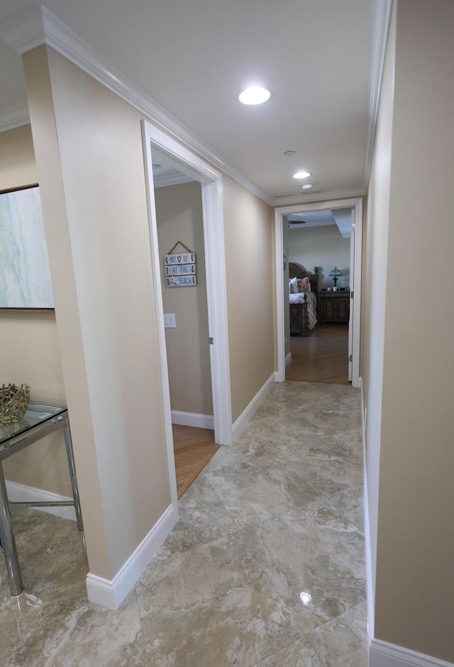 hallway featuring recessed lighting, baseboards, and ornamental molding