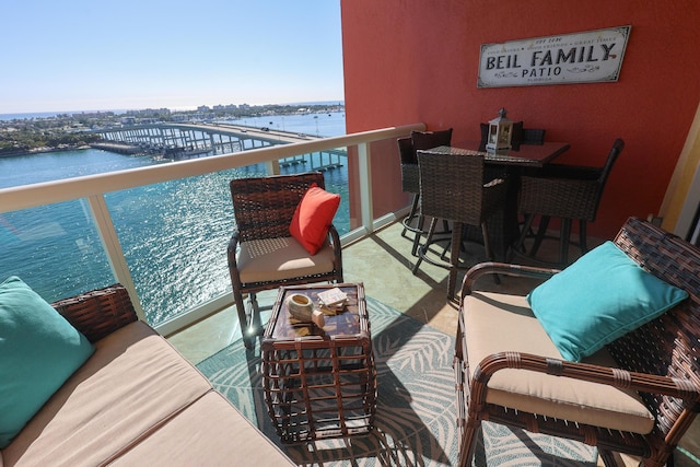 balcony featuring a water view