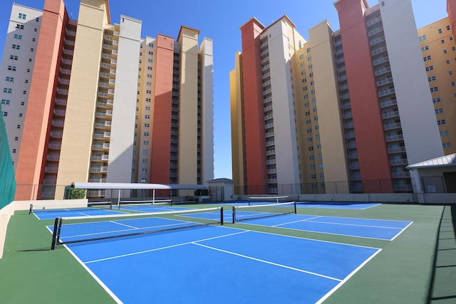 view of sport court featuring fence