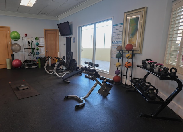 exercise room with ornamental molding