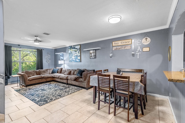 tiled living room with ornamental molding, visible vents, and baseboards