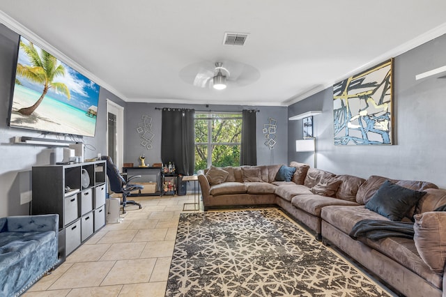 living area featuring light tile patterned floors, ceiling fan, visible vents, and ornamental molding