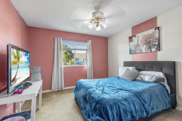 bedroom featuring carpet floors, baseboards, and a ceiling fan