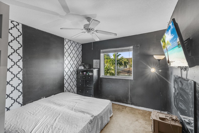 carpeted bedroom with a ceiling fan