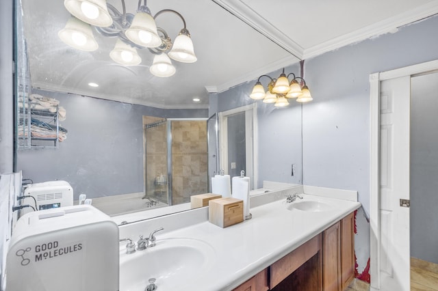 bathroom with crown molding, a sink, a tile shower, and an inviting chandelier