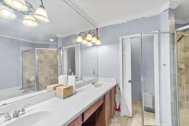 full bath with a stall shower, a sink, and crown molding