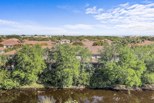 birds eye view of property with a water view and a residential view