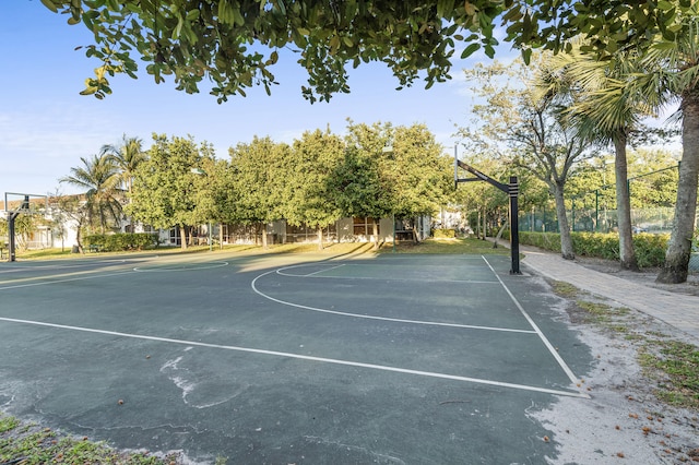 view of basketball court featuring community basketball court and fence