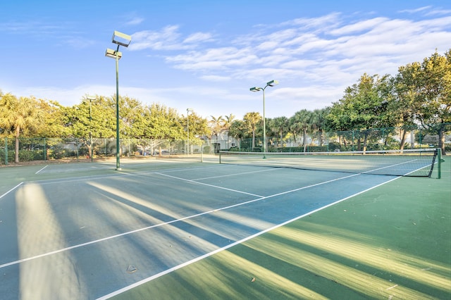 view of sport court featuring fence