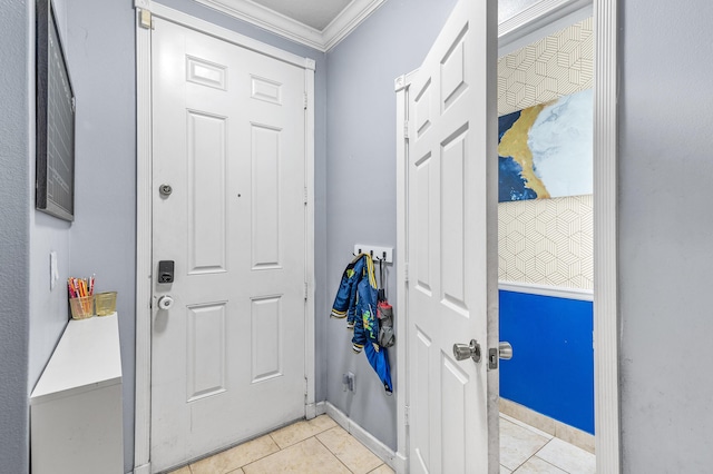 entryway featuring ornamental molding, baseboards, and light tile patterned floors